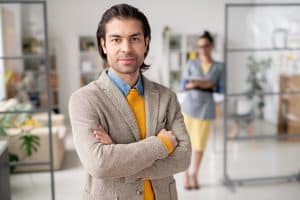 business owner standing with arms crossed