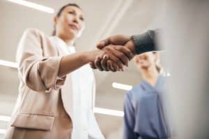 Close up handshake in office setting