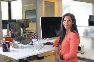 Woman smiling at desk